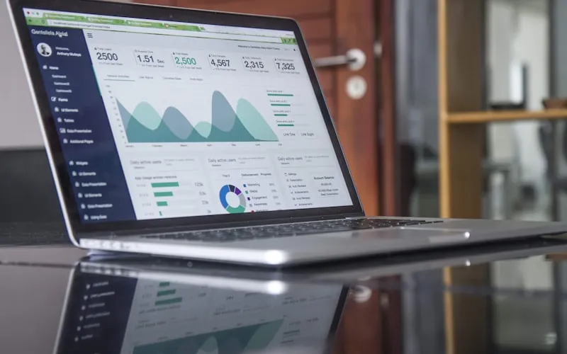 Digital marketer planning SEO, social media and content campaigns with analytics on screen